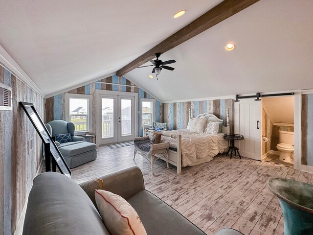 2025 Vista Dr, Crystal Beach, TX 77650 - bedroom with light wood finished floors, access to outside, a ceiling fan, wallpapered walls, and ensuite bath