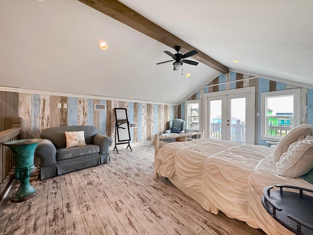 bedroom featuring ceiling fan, french doors, hardwood / wood-style floors, lofted ceiling with beams, and access to exterior