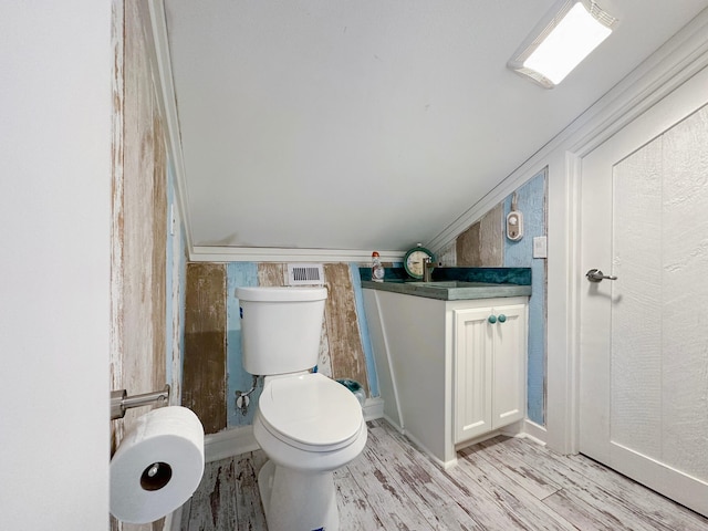 2025 Vista Dr, Crystal Beach, TX 77650 - half bathroom with toilet, wood finished floors, and vanity