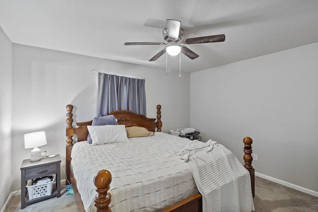 bedroom with ceiling fan and light colored carpet