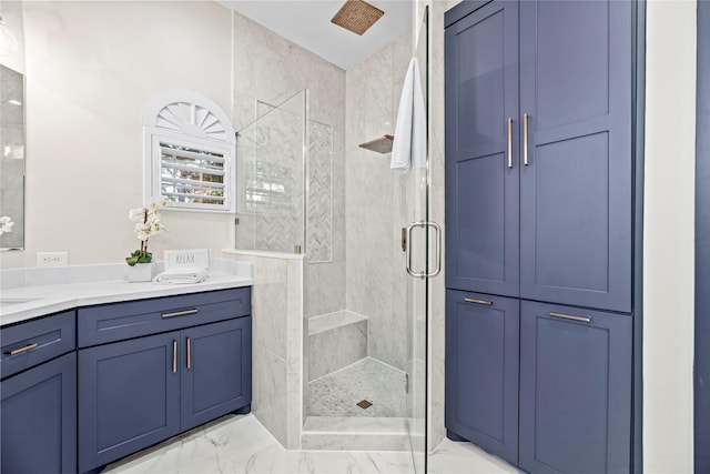 bathroom featuring vanity and a shower with shower door