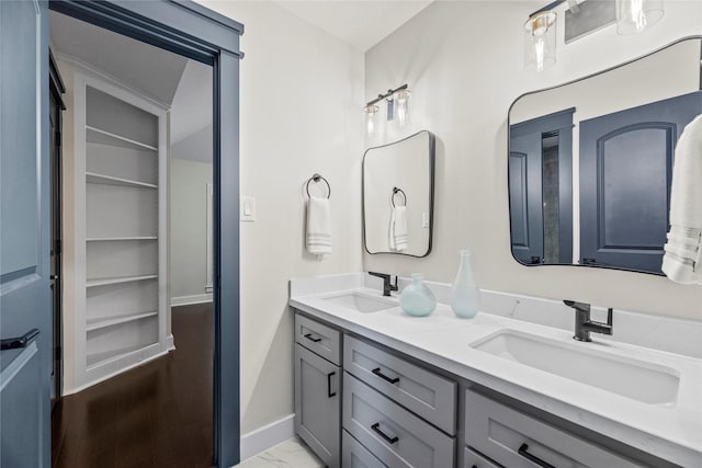 bathroom with vanity and built in features