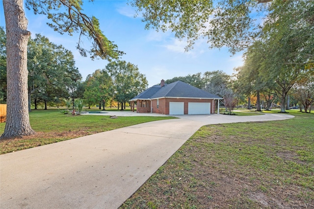 exterior space with a yard and a garage