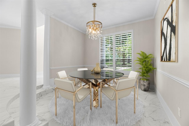 dining area with ornamental molding, an inviting chandelier, and decorative columns