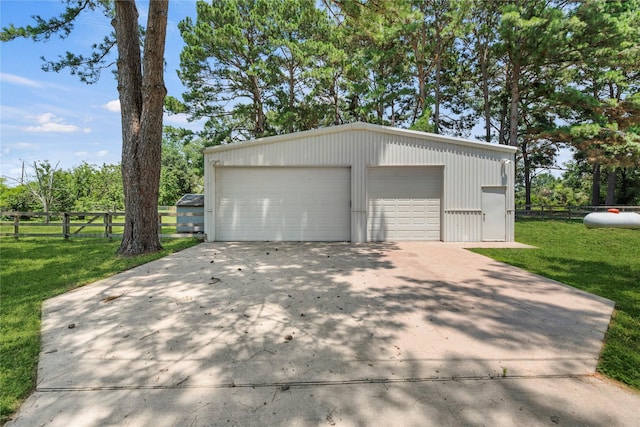 garage with a lawn