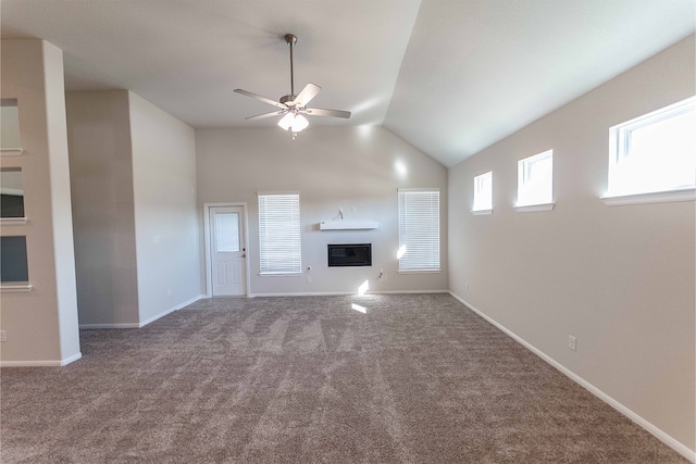 unfurnished living room featuring carpet floors, vaulted ceiling, and ceiling fan