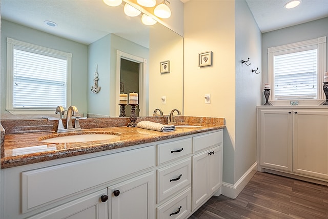 bathroom featuring vanity and hardwood / wood-style floors