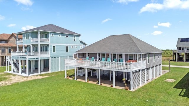 rear view of property with a lawn and a patio