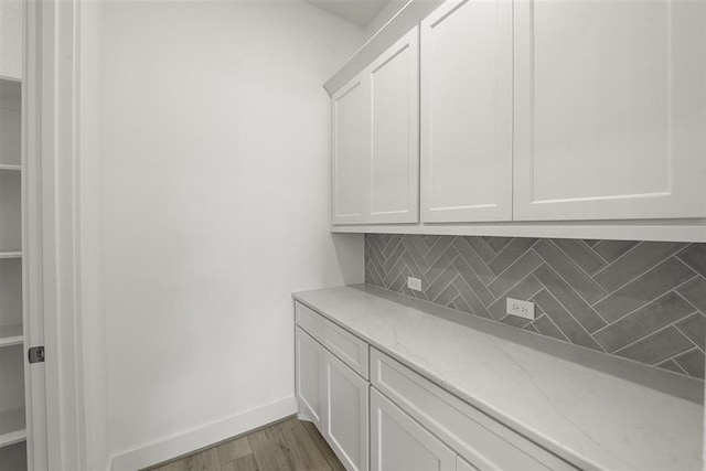 washroom with hardwood / wood-style flooring