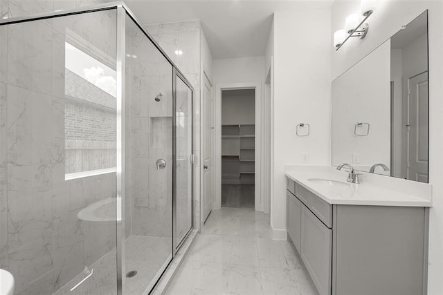 bathroom with vanity, a shower with shower door, and tile patterned floors