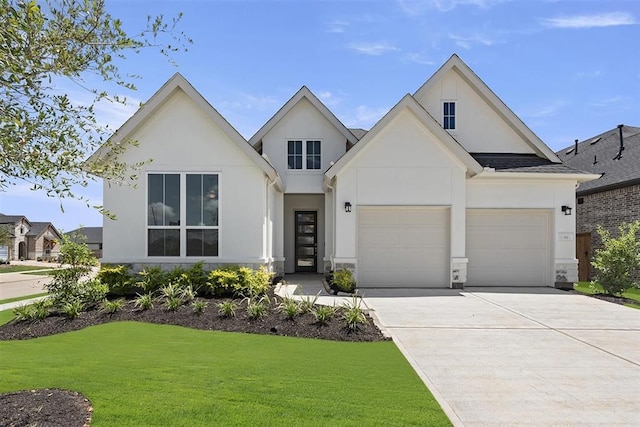 modern farmhouse featuring a garage and a front yard