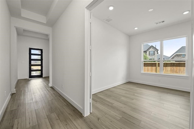 hall with light hardwood / wood-style flooring