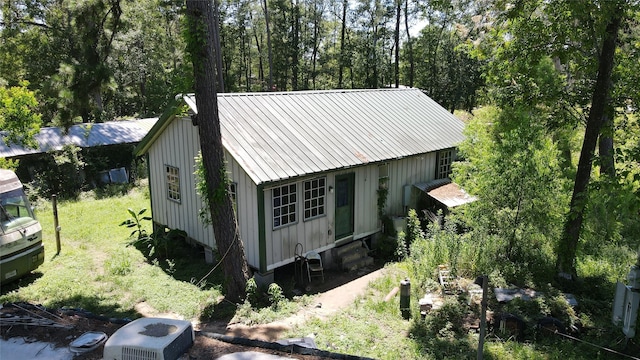 exterior space with metal roof and board and batten siding