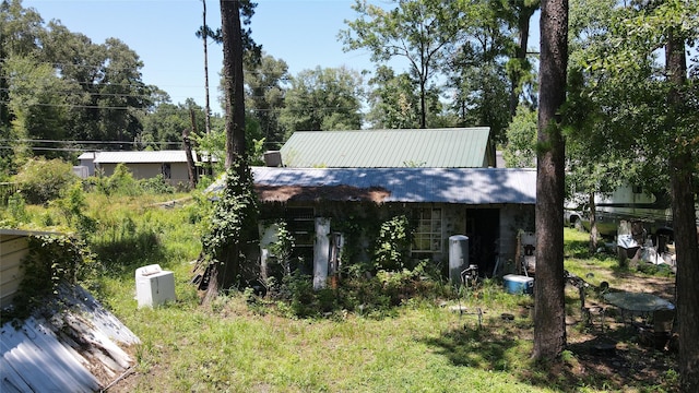 exterior space featuring metal roof