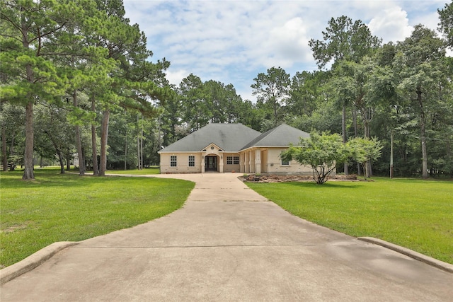 ranch-style home with a front yard