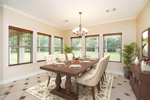 dining space featuring a healthy amount of sunlight, ornamental molding, and a chandelier