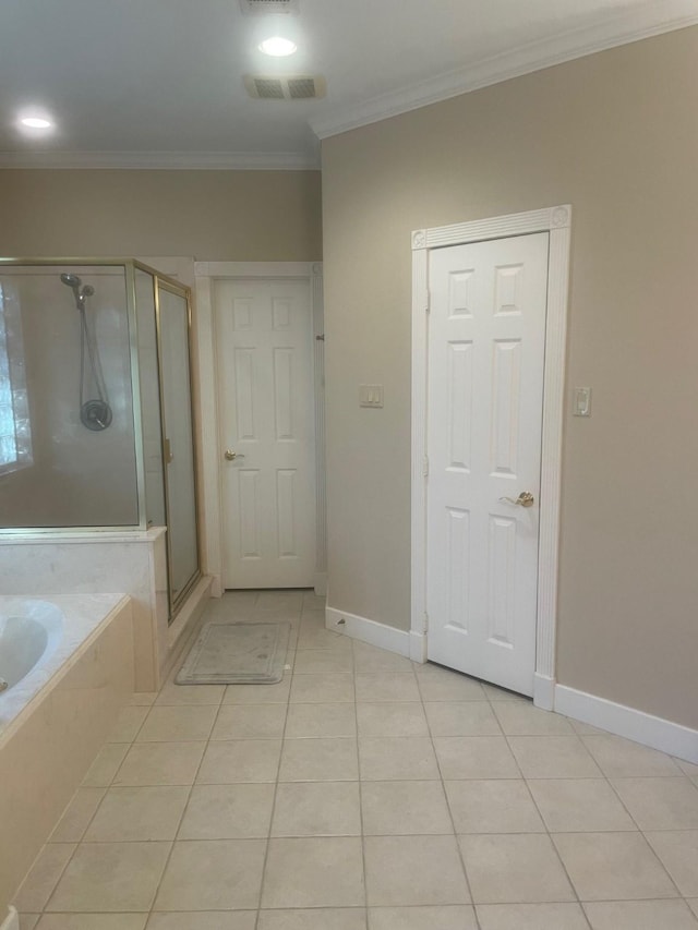 bathroom with tile patterned flooring, separate shower and tub, and crown molding