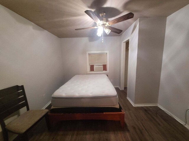 bedroom with dark wood-type flooring and ceiling fan