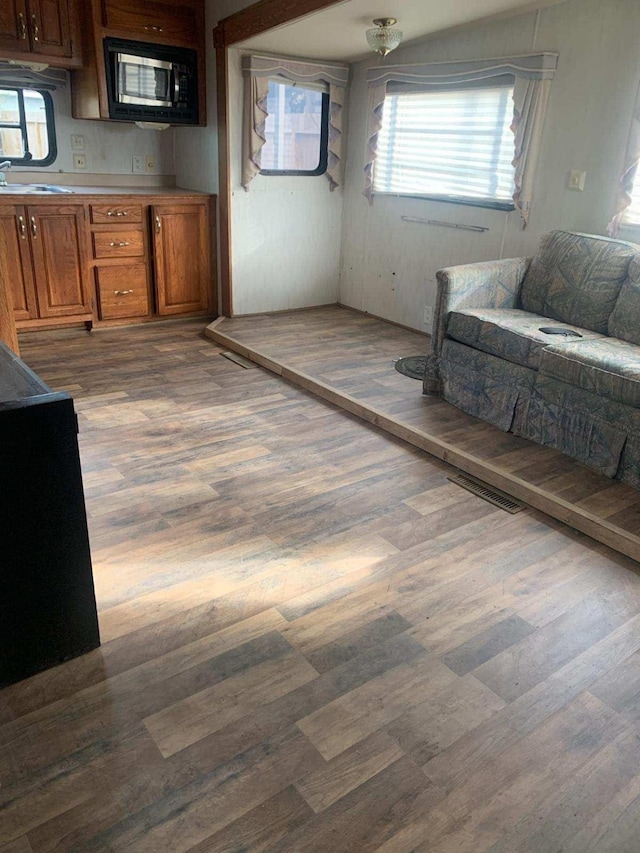 interior space with hardwood / wood-style flooring and sink