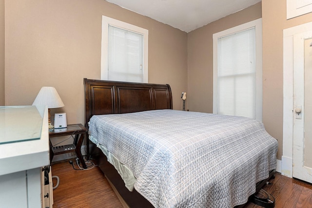 bedroom with hardwood / wood-style floors