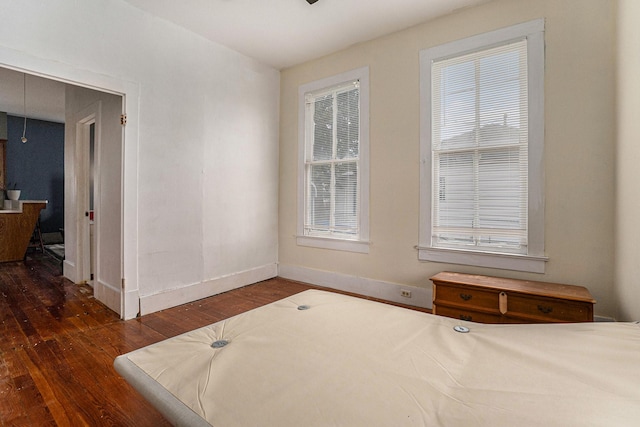 bedroom featuring dark hardwood / wood-style flooring