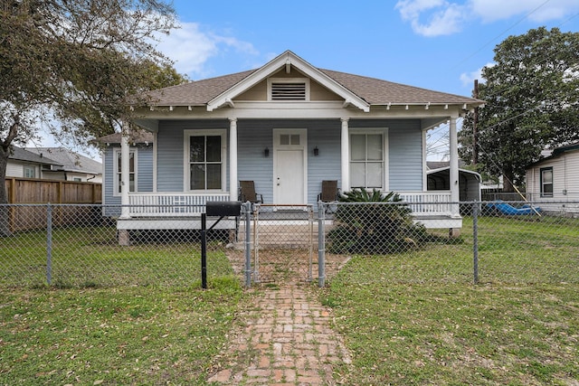 bungalow featuring a front yard and a porch