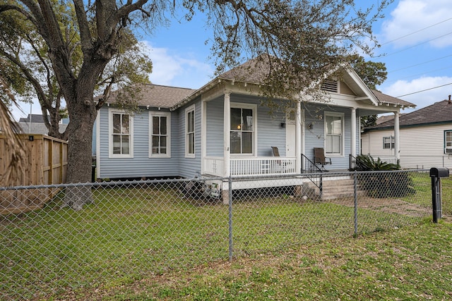 bungalow featuring a front yard and a porch