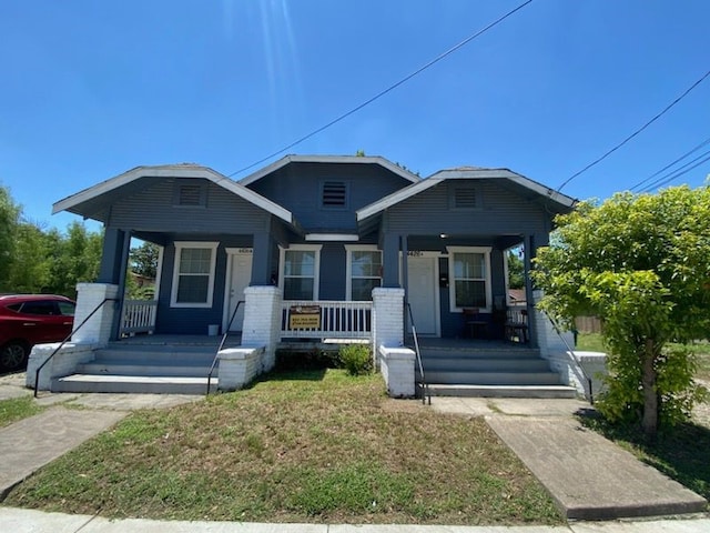 view of front of property featuring covered porch