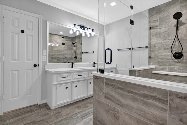 bathroom with vanity and an enclosed shower