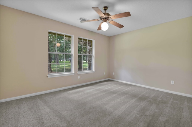 carpeted empty room featuring ceiling fan