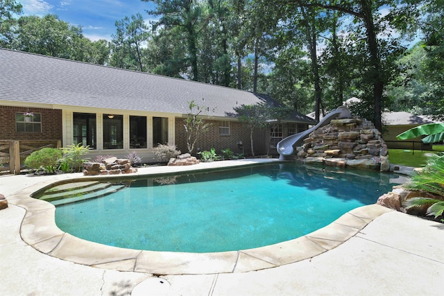 view of pool featuring a water slide