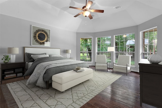 bedroom with hardwood / wood-style flooring, ceiling fan, and lofted ceiling