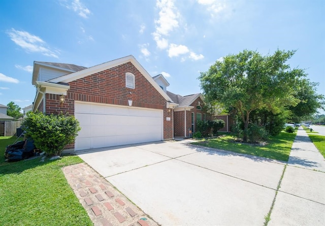 view of front of home featuring a garage and a front yard