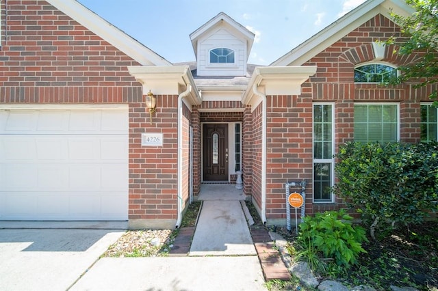 doorway to property featuring a garage