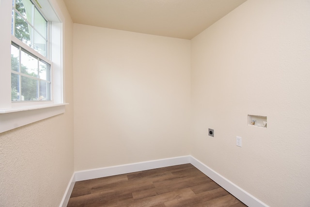 laundry area with washer hookup, electric dryer hookup, and dark wood-type flooring