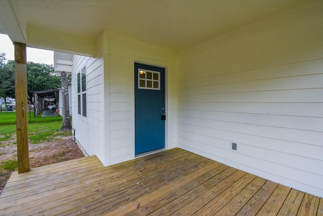 doorway to property with a wooden deck