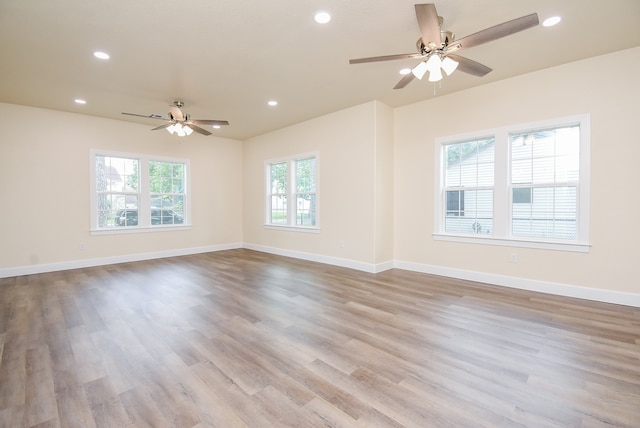 unfurnished room featuring ceiling fan and light hardwood / wood-style flooring