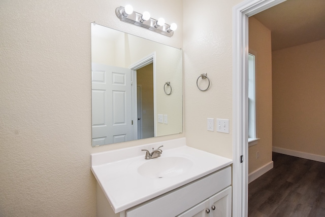 bathroom featuring vanity and hardwood / wood-style flooring