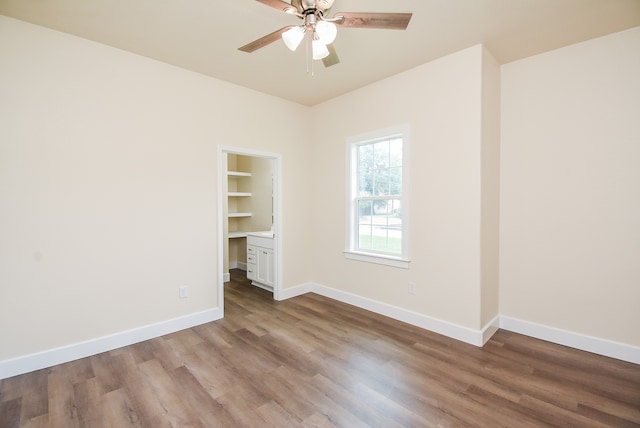 unfurnished room featuring light hardwood / wood-style flooring and ceiling fan