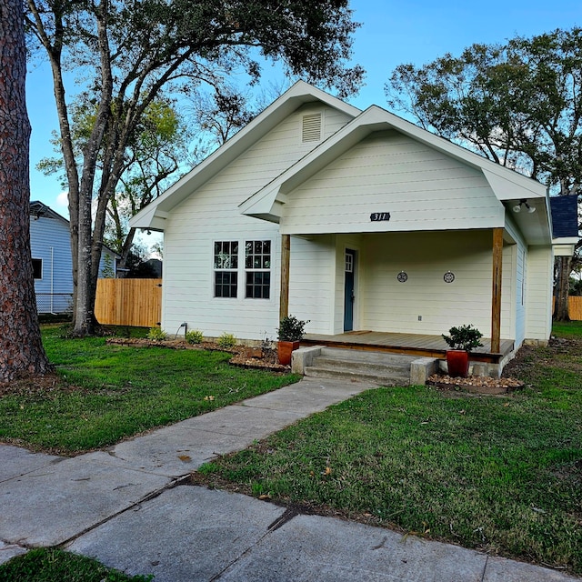 view of front of house featuring a front lawn and a porch