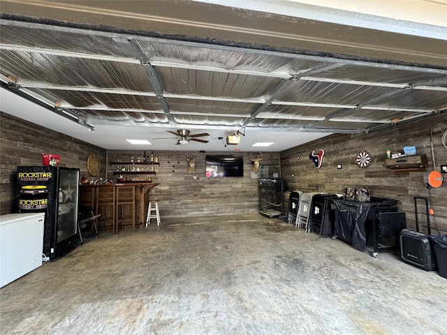 garage featuring ceiling fan and a garage door opener