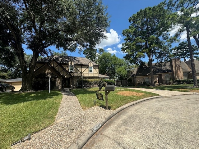 tudor house with a front lawn