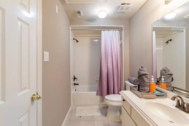 bathroom with visible vents, toilet, tile patterned floors, shower / bath combo with shower curtain, and vanity