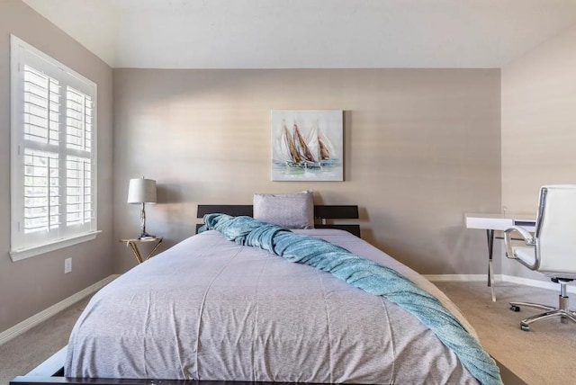 bedroom with carpet flooring and baseboards