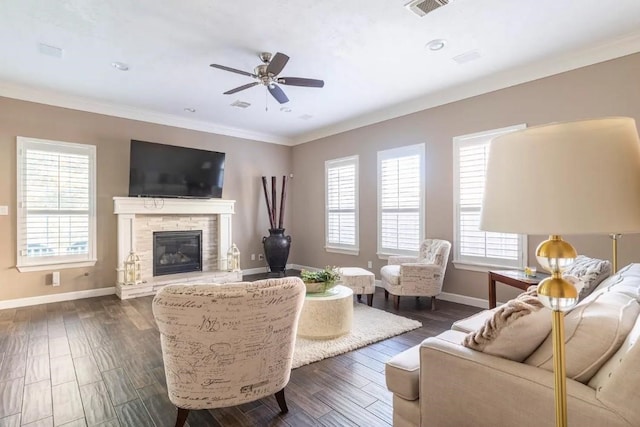 living room featuring baseboards, ornamental molding, and dark wood-style flooring