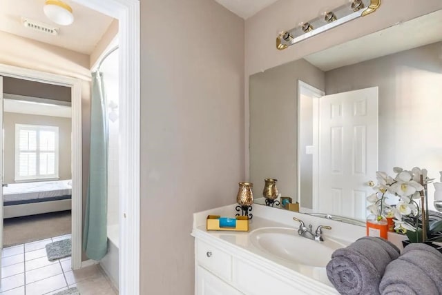 bathroom with shower / tub combo with curtain, visible vents, vanity, ensuite bath, and tile patterned floors