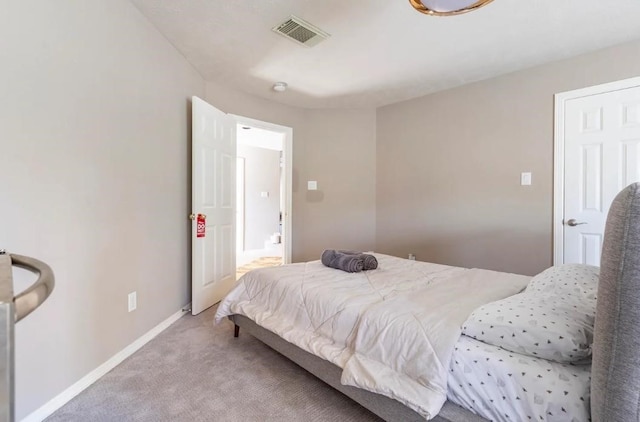 carpeted bedroom with baseboards and visible vents