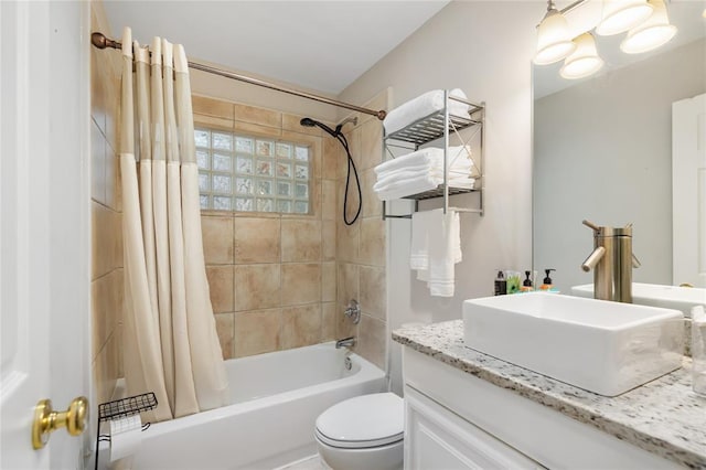 full bathroom with shower / bath combo, vanity, and toilet