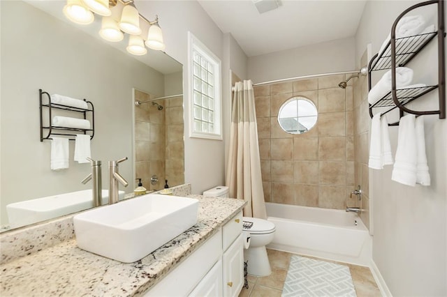 full bathroom with toilet, tile patterned flooring, shower / bath combo with shower curtain, vanity, and a chandelier