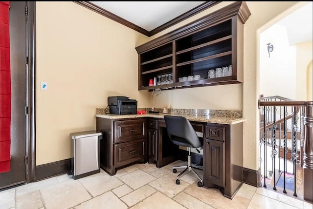 home office featuring built in desk and ornamental molding